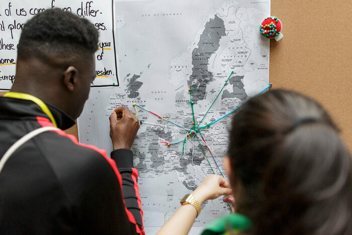 Participants putting their city name on a map