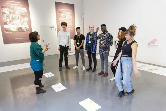 Artist Yaelle Dorison explores with her group of participants the concept of education