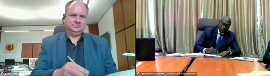 Videokonferenz-die Oberbürgermeister Dirk Hilbert und Diedonné Bantsimba unterzeichnen das gemeinsame Arbeitsprogramm