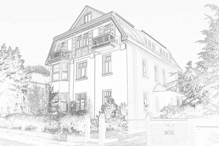 Freistehendes, gelbes Mehrfamilienhaus mit Balkonen