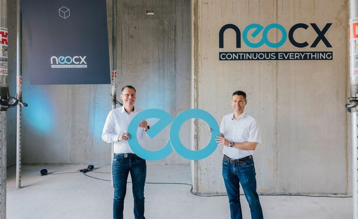 Axel Heinrich, Volkswagen Head of Electrics/Electronics Development, and Rocco Deutschmann, Managing Director of TraceTronic, celebrate the founding of neocx in Dresden.