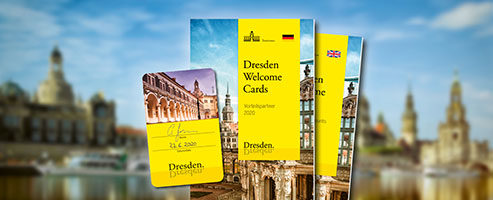 Sample card and brochure of the Dresden Welcome Cards in front of the famous city skyline of Dresden.